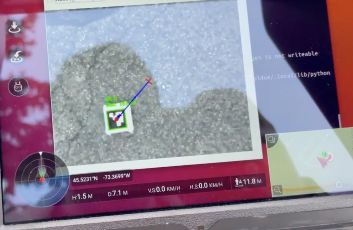 Ground-station view of an ArUco marker locked by the tracker with target vector and telemetry