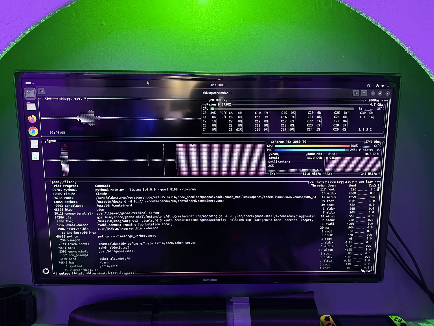 Monitor showing live GPU and system telemetry beside a terminal on the on-prem rack