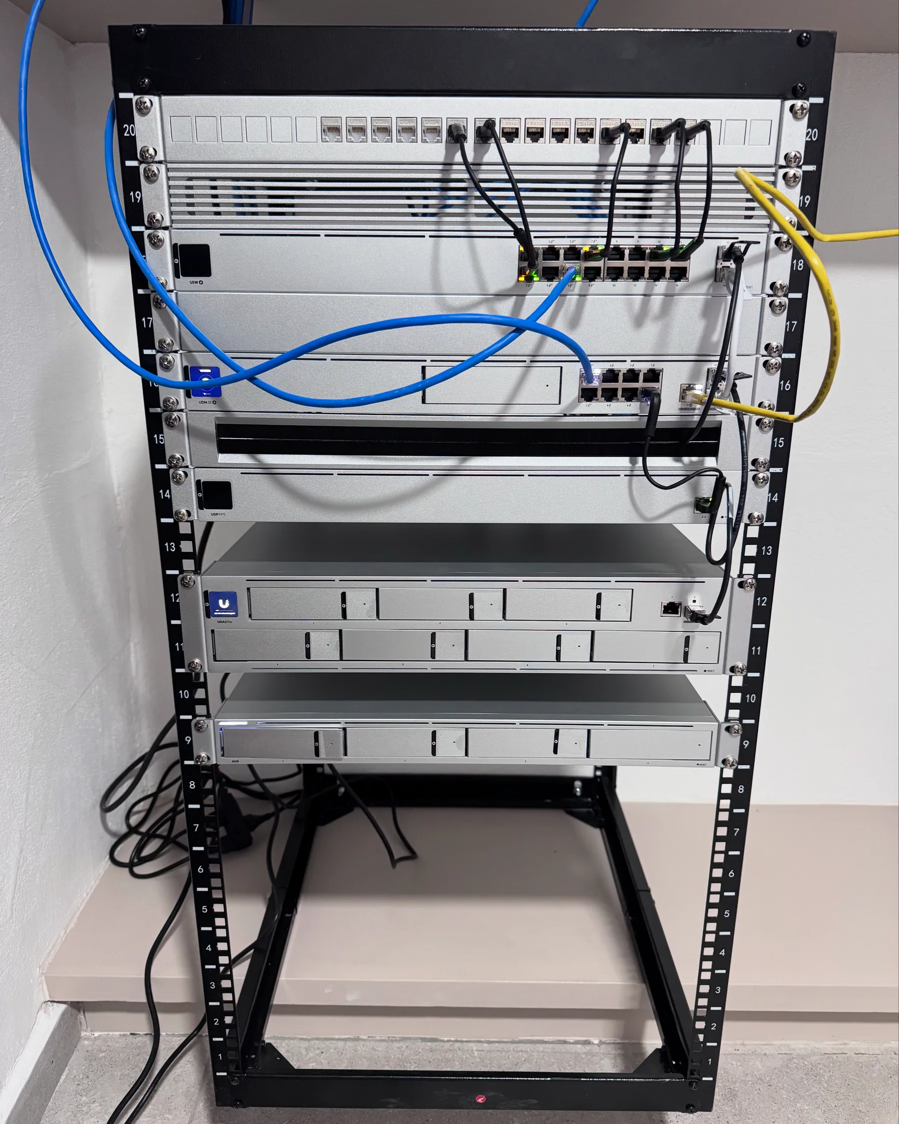 Structured network rack with managed switches, CAT6A patch panels and cable management