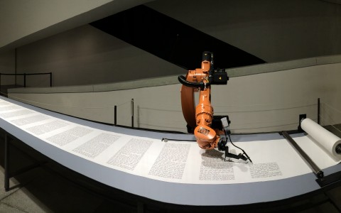 Robot arm writing the Torah